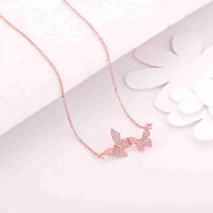 Iraasa Jewellers Butterfly Pendant Necklace—a rose gold chain with three butterfly charms adorned with sparkling stones, elegantly crafted for stylish wear.