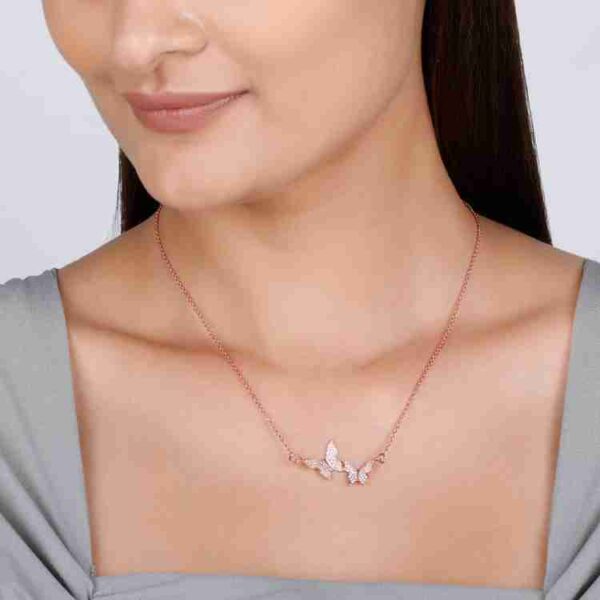 Iraasa Jewellers Butterfly Pendant Necklace—a rose gold chain with three butterfly charms adorned with sparkling stones, elegantly crafted for stylish wear.