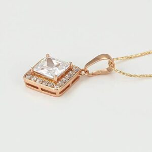 Iraasa Square Gold-Polished Pendant Necklace featuring an elegant locket design with shimmering stones.