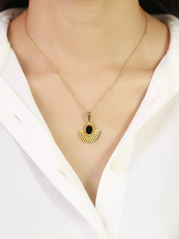 Iraasa Jewellers Sunburst Pendant Necklace—a gold-plated chain featuring a black oval stone in a radiant sunburst design.