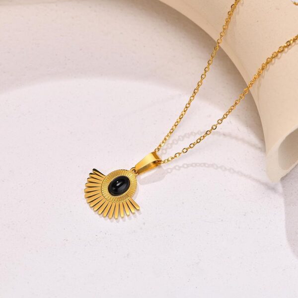 Iraasa Jewellers Sunburst Pendant Necklace—a gold-plated chain featuring a black oval stone in a radiant sunburst design.