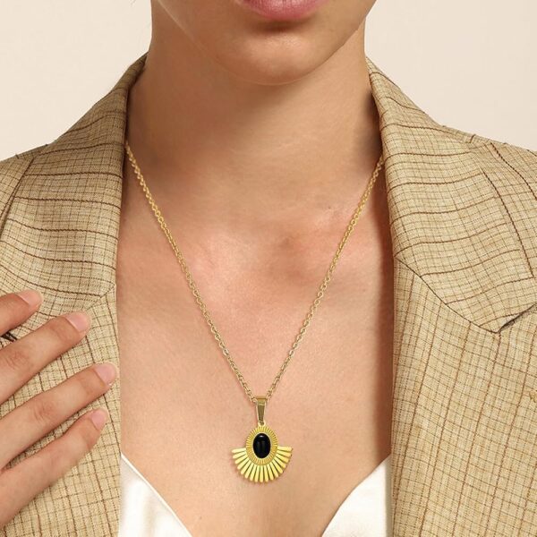 Iraasa Jewellers Sunburst Pendant Necklace—a gold-plated chain featuring a black oval stone in a radiant sunburst design.