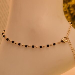 Elegant Iraasa Golden Noir Anklet featuring black and gold beads with a secure lobster clasp