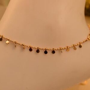 Elegant Iraasa Midnight Radiance Anklet featuring black square beads and gold accents on a delicate chain.