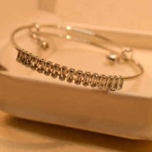 The Iraasa Collection Silver Plated White & Black Stone Bangle Bracelet is a luxurious piece designed for those who appreciate fine craftsmanship. This elegant bracelet, crafted by Iraasa Jewellers, features a premium silver-plated finish adorned with white and black stones, offering a sophisticated contrast. Whether you love timeless Bangle Bracelet Designs or a modern Half Bracelet, Half Bangle look, this piece effortlessly complements both casual and formal outfits. Its refined elegance makes it an ideal choice for those seeking stylish Bangle Bracelets for Women and Girls without compromising on exclusivity.